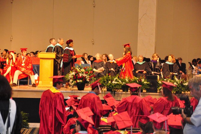 McLean High School senior Linda He receives her diploma at graduation Thursday, June 14 at DAR Constitution Hall. 