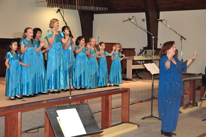 The World Children's Orchestra performs a welcoming song at Charles Wesley United Methodist Church Saturday, June 16, part of a benefit concert for Share of McLean. 