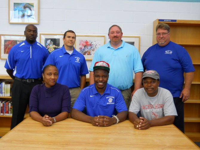 Pictured from left: Sandra Hooks (mother), TaMaric Wilson, Stacey Wilson (father), coach Chad Louisville, coach Justin Gaudenzi, DSA Aaron Helmick, coach Eric Henderson.