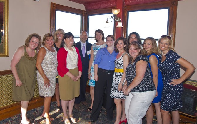 ACVA president and CEO Stephanie Pace Brown, sixth from left, joins board chairman Jody Manor and the ACVA staff for a group photo aboard the Cherry Blossom during the June 15 Summer Social. The event served as a farewell to Brown, who will take over as president of the Asheville, N.C. Convention and Visitors Bureau.
