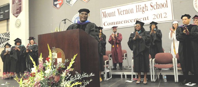 Commencement speaker, Col. Gregory D. Gadson, a bilateral above-the-knee amputee resulting from injuries sustained in a roadside bombing in the Iraq War, receives a standing ovation from the students and guests at the Mount Vernon High School 2012 Commencement Exercises on Friday afternoon, June 15 at the high school. Gadson said nothing made him prouder on this day than the perseverance of his graduating son, Jaelan. Gadson has served in the U.S. Army for more than 20 years as a field artillery officer and on active service for; Desert Shield/Desert Storm (Kuwait), Operation Joint Forge, Bosnia, Afghanistan and Operation Iraqi Freedom. While serving in the U.S. Army he has been awarded 3 Bronze Stars, a Purple Heart, Meritorious Service Medal and the Army Commendation Medal.
