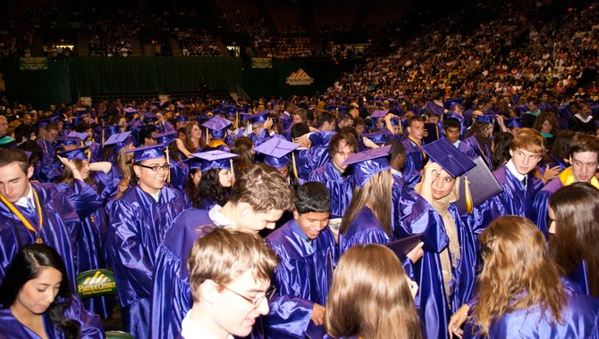 A sea of purple as graduate candidates officials become graduates of Lake Braddock Secondary School after Senior Class Vice President Majd Hosein instructs them to "turn their tassels" during the Class of 2012 graduation ceremony June 15 at The Patriot Center on the George Mason University campus.