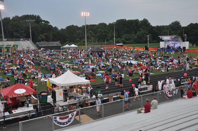 Local residents gather at Langley High School for the annual McLean Community Center fireworks show. Gates will open at this year’s event at 8 p.m. July 4. 