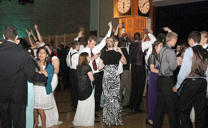 Youth dancing with "Big Ben" in background.