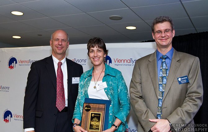 Pictured above (from left) at the 2012 Vienna Tysons Regional Chamber of Commerce Business and Service Awards are Dr. Gerald Gordon, Master of Ceremonies and President and CEO of the Economic Development Authority in Fairfax County; Michelle Scott, Executive Director of the Shepherd’s Center of Oakton-Vienna and recipient of the 2012 Vienna Tysons Regional Chamber of Commerce Nonprofit of the Year Award; Kevin McCoy, Board Chair of the Vienna Tysons Regional Chamber of Commerce and an attorney with Kruchko and Fries in McLean. 