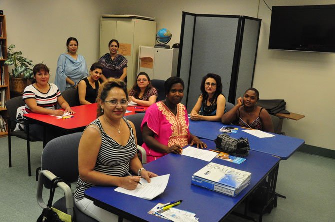 Members of Express Care’s Personal Care Aide Class complete an exam at the Herndon Neighborhood Resource Center