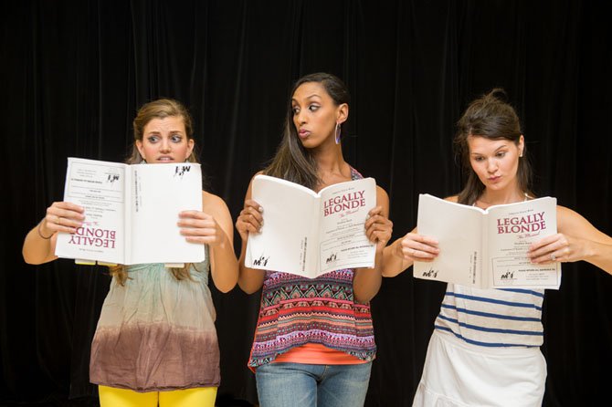 Margot (Margaret Berkowitz), Pilar (Kim Braswell) and Serena (Courtney Drake), the Greek Chorus, hitting the books.