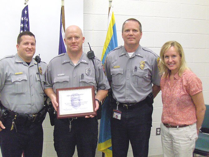 From left are 2nd Lt. Ryan Morgan; PFC Gerard Sullivan; Lt. John Trace, assistant commander, Sully District Station, and Leslie Jenuleson, CAC chairman.