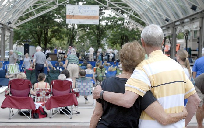 Area residents enjoy the musical offerings of the Upper East Side Big Band from Richmond in Reston on Saturday night as part of the Reston Concerts on the Town at the Reston Town Center Pavilion. 