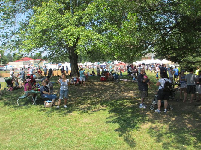 "Gimme Shelter" singing sages said. At almost 100 degrees, festival-goers sought shade.