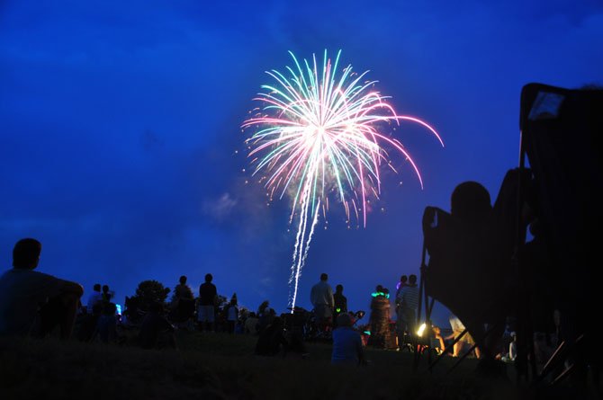 Guests watch fireworks on the lawn at Turner Farm Saturday, July 14. 