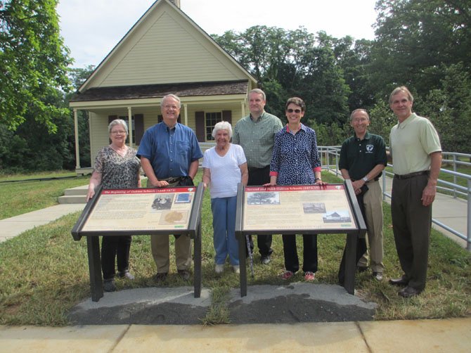 County Park Authority preservation specialist Karen Lindquist, HMDL historian Charles Balch, great-granddaughter of first schoolhouse teacher Pat Price, HMDL historian Steve Hull, Providence District Supervisor Linda Q. Smyth, County Park Authority Board Providence District Representative Ken Quincy, and County Park Authority Director John Dargle, Jr. unveil interpretive panel markers at the Oakton Schoolhouse.

