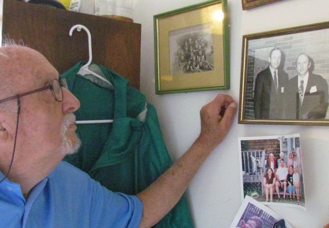 Bob Cromwell, the former NASA engineer, is looking at his treasured photo of himself with Neil Armstrong at an event just after the moon landing.