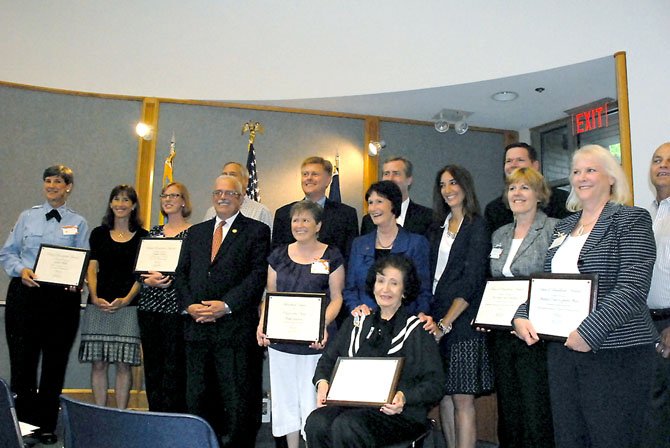 From left to right are the eight recipients of the 2012 Best of Braddock Awards and regional political leaders who attended the event: Gaela Hime, Fairfax County School Board Representative for the Braddock District Megan McLaughlin, Katherine Stramel, U.S. Rep. Gerry Connolly (D-11), State Senator David Marsden, Supervisor John Cook (R-Braddock District), Kathy Augustine, Fairfax County Board of Supervisors Chairman Sharon Bulova (D-At Large), Del. David Bulova, Del. Eileen Filler-Corn, Patrick Gloyd, Anita Musser receiving the award on behalf of The Burke Centre Conservancy, Lisa Carroll receiving the award on behalf of the Shepherd Center and Bill Barfield, chairman of the Braddock District Council of Community Associations. Dawson Taylor, who received the Young Person of the Year award, was not present.
