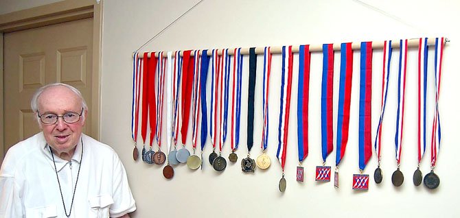 Dr. Ernst with his wall full of medals. 