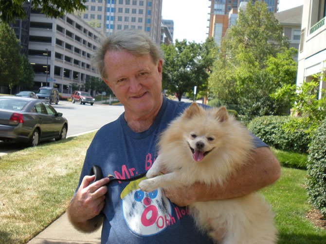 Frank Chanka with Bear with neighboring Reston Town Center in background.