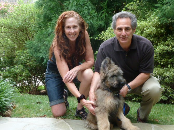 The Rosenbergs and their puppy Chance.