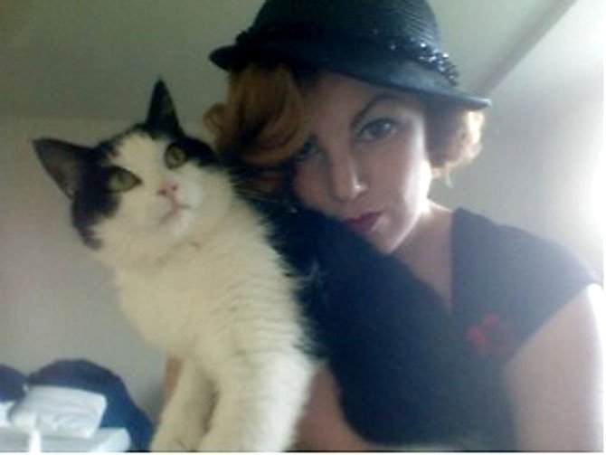 Esme Bass of Springfield poses with her cat, Jack.