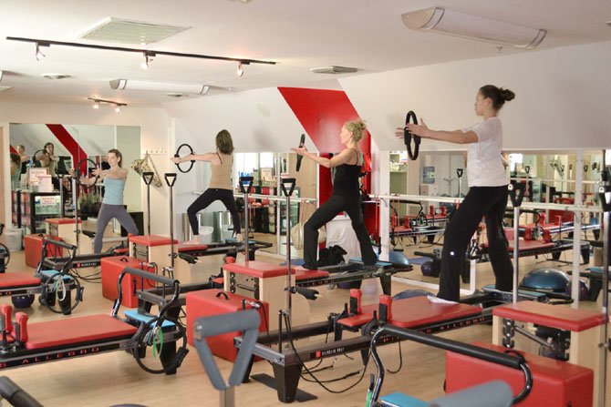 Students at the Potomac Tennis Club work to tone and tighten their muscles. Fitness experts say that while it is possible to change one's body, not everyone can look like an Olympic athlete.