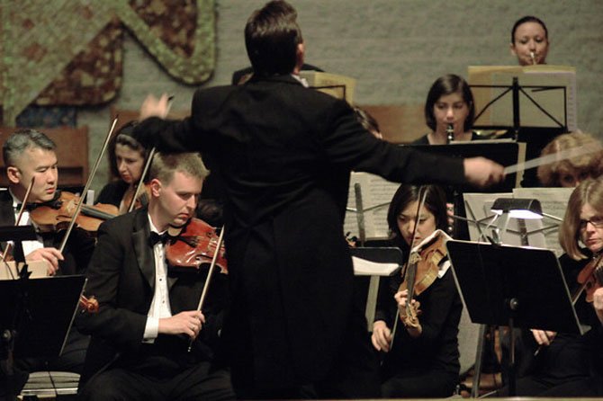 Director A. Scott Wood conducts the Amadeus Orchestra.