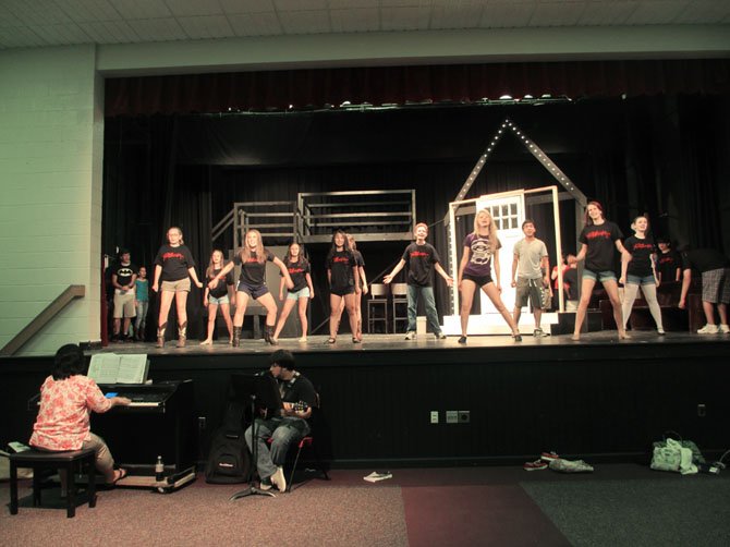 The cast of "Footloose" goes full-throttle at rehearsal.