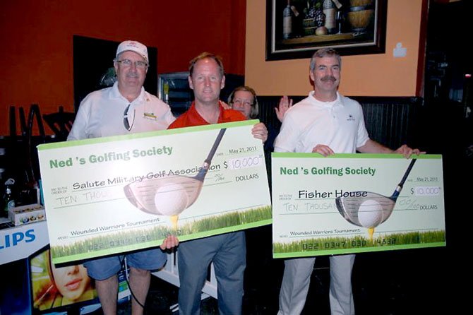 From left, Dave Lewis of Ned Devine’s Golfing Society, Jim Estes of the Salute Military Golf Association and Brian Gawne of Fisher House, with funds raised by last year’s golf tournament to benefit wounded warriors. This year’s tournament will take place Sept. 22 at Herndon Centennial Golf Course. 