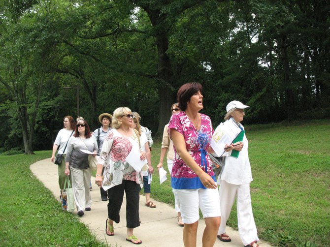 Amy Swaak, MPAartfest Coordinator, leads MPAartfest artists through McLean Central Park.