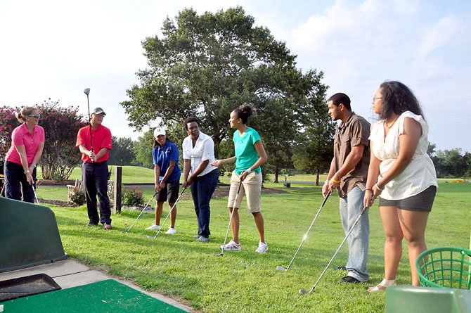 Golfers at the Herndon Centennial Golf Course take part in a clinic to raise funds for Cindy’s Legacy, which raises money for cancer patients and their families, Friday, Aug. 3. 
