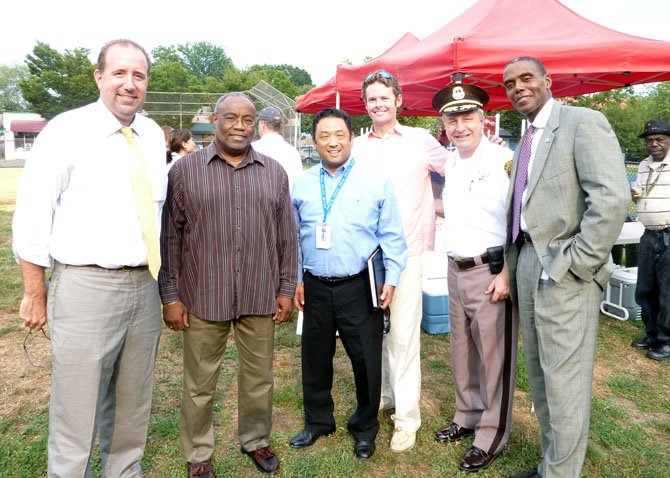 City Councilman Frank Fannon, Mayor Bill Euille, Daniel Mineta, Brian Porter, Sheriff Dana  Lawhorne and City Attorney James Banks gather at the Mount Vernon Recreation Center field Aug. 7 to kick off National Night Out festivities.
