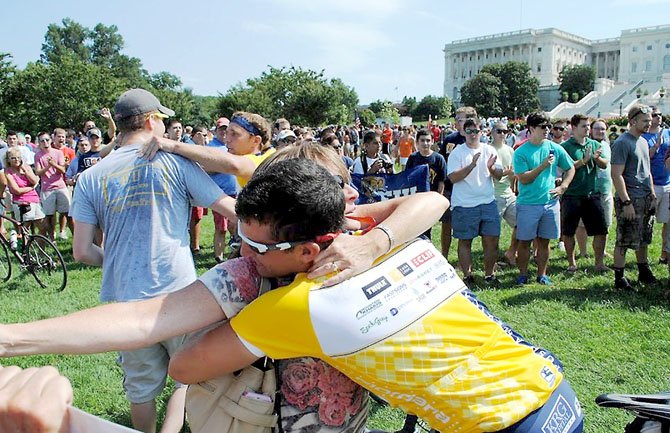 Mom Anne Marie Rieck waited several hours with family and friends in the blistering heat on Sunday, Aug. 5, to give son Dan Rieck a homecoming hug during a celebration and parade held on the west lawn of the U.S. Capitol. 