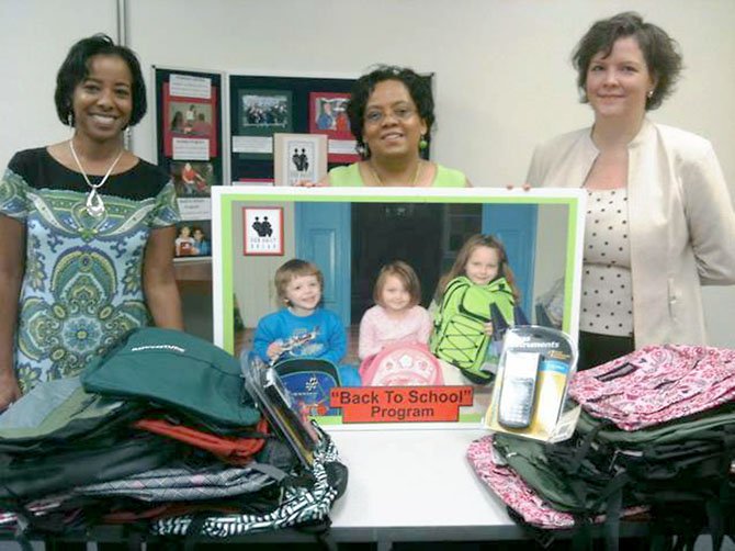 From left, Wren Kelly-King and Lauren Fallen of the Divine Dining Divas present $700, 52 backpacks and four scientific calculators to Our Daily Bread Development Manager Jennifer Rose to support ODB’s 2011 Back to School Program. The donations were made by their fellow group members and their colleagues at the Fairfax County Department of Safety Communications.