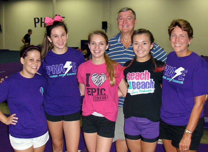 At the new, all-star gym are (back row) Mark Culin and (front row, from left) Jelaire Grillo, Sam Culin, Becca and Hannah Weinert and Susan Culin. 
