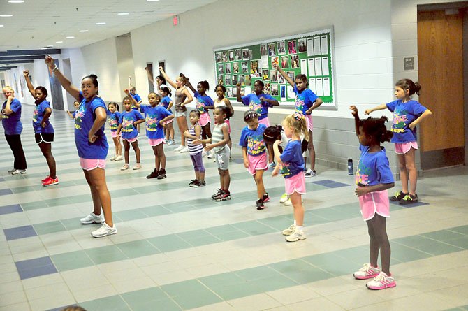 Members of Reston Youth Cheer practice at South Lakes High School. The group is open to girls from kindergarten to 12th grade. 