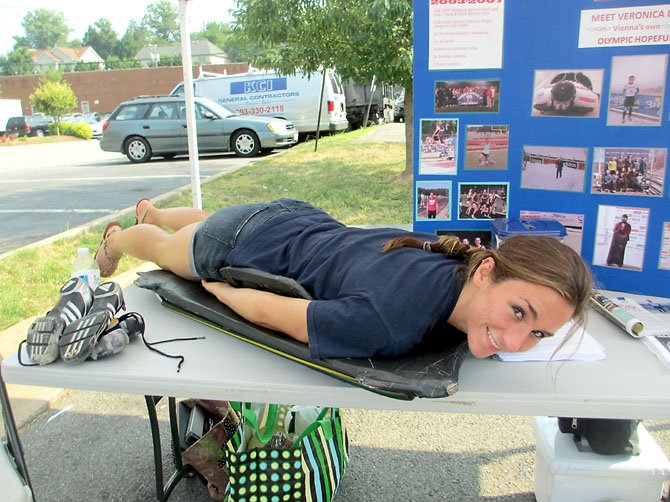 While it is unlikely that Olympic hopeful Veronica Day would be smiling this broadly in competition, she is happy to exhibit her skeleton sled form.