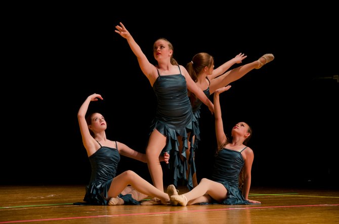 Recital performance of ‘Rapunzel’ at W. T. Woodson High School. The girls dance a contemporary piece titled 'Chariots.'