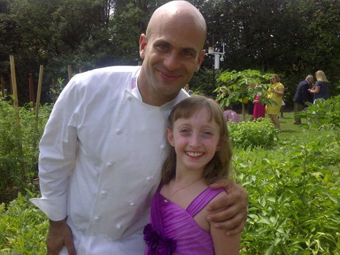 Madeleine Steppel, 9, meets White House Assistant Chef Sam Kass Monday, Aug. 20, after winning an online competition. 