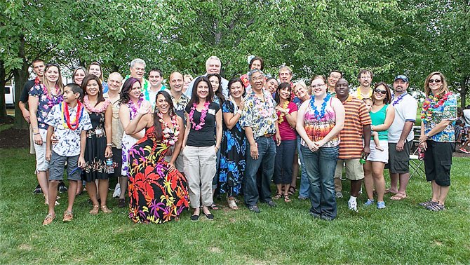 A majority of the employees attending Primescape Solutions End of Summer Celebration are finally herded together for a group photo.