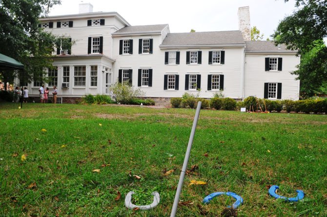 Horseshoes await players in the side garden at the Lee-Fendall House.