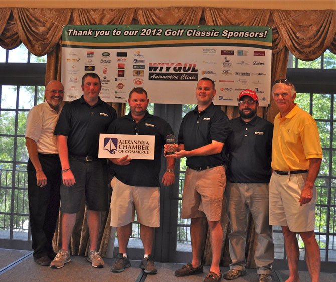 Alexandria Chamber of Commerce president John Long, left, is joined by Wiygul Automotive's winning team of George Ball , W.D. Wiygul, Zack Wiygul and Dave Krukowski following the annual golf tournament at Belle Haven Country Club Aug. 27. At right is tournament committee chairman Roger Parks.