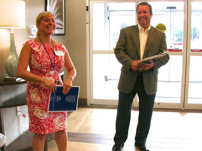 Chamber Chairman Michael Gailliot and June Campola of Candlewood Suites welcome guests.