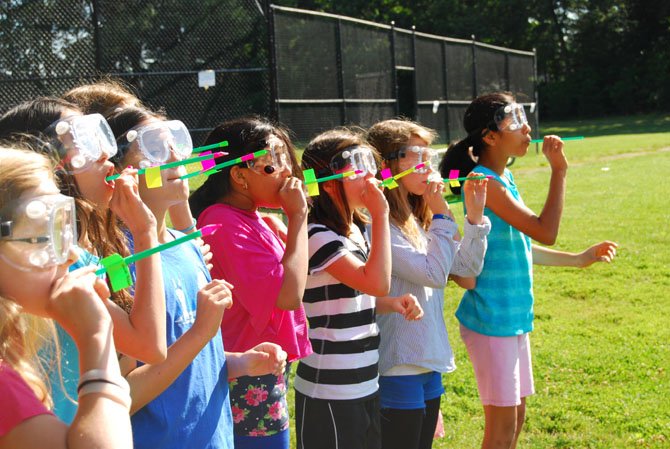 GFES fifth graders demonstrate Newton's laws of motion
with their straw rockets.