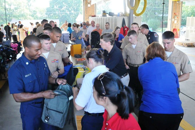 Over 100 volunteers and sponsors filled the north bay at #11 Penn Daw to fill the school backpacks.