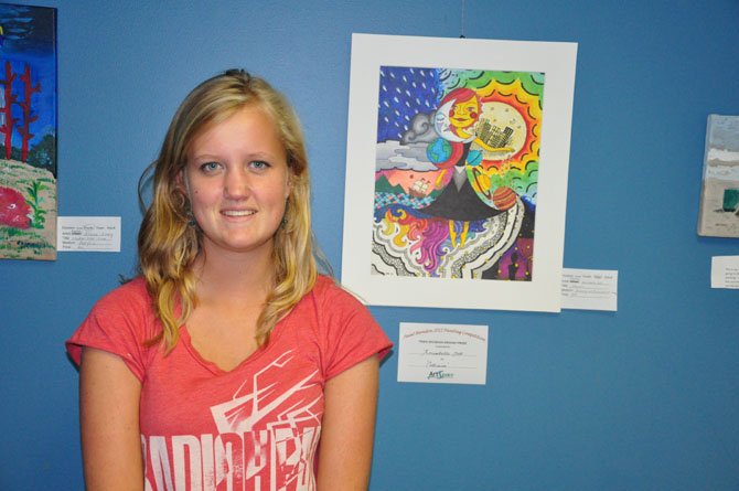 Annabell Goll, winner of the teen division at the annual Paint Herndon competition Saturday, Sept. 1, with her painting, "Collision."