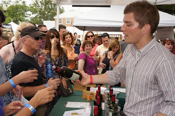 Adam Reinhard, an ABC manager from Barboursville Vineyards, has no trouble keeping up with all of the festival goers wanting to try a taste.