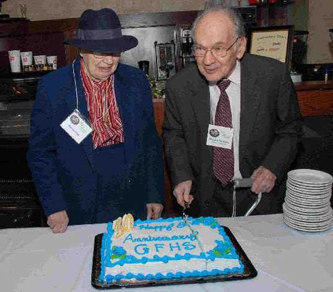 Marion Reid and Milburn Sanders, lifetime residents of Great Falls, honored by cutting the cake on the occasion of the 30th Anniversary Celebration of the Great Falls Historical Society, Feb. 19, 2008.
