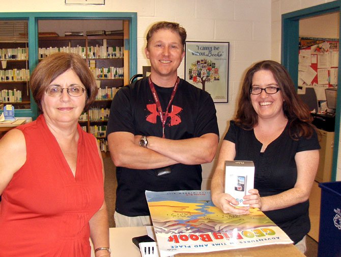 From left: Poplar Tree Elementary librarian Cindy Uncles, P.E. teacher Rob Thompson and special-ed teacher Mandy Moore are happy about the start of school.