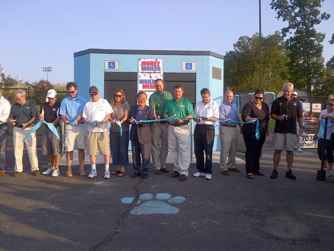 Those cutting the ribbon for Centreville High’s new, artificial-turf fields included Supervisors Michael Frey and Pat Herrity, Centreville Principal Martin Grimm (not pictured) and School Board members Ilryong Moon and Elizabeth Schultz.