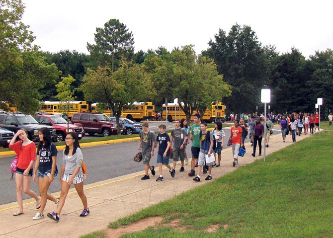 Rocky Run students walk from their buses to the school.
