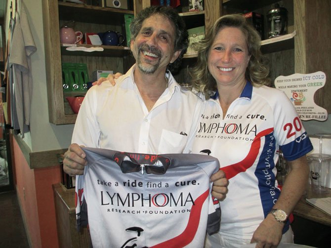 Remission Ride team leader Valerie Kappler with Caffe Amouri owner Michael Amouri at the shop’s Coffee for a Cure on Sept. 7.