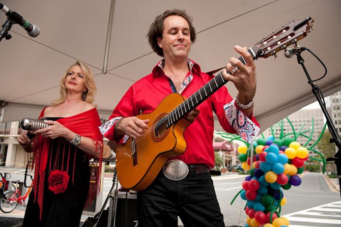 Deborah Benner and Michael Bard are members of Trio Caliente, a Latin jazz group that has performed at the Crystal City Taste of Wine and Jazz the previous four years. The group will be center stage this year, and will provide live tunes of energetic rumba for dancers and wine samplers alike. Photo courtesy of Crystal City BID.